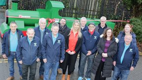 Stephen Gamble, Breige Mullaghan, Poppy Buchanan and John Duffin with Toome Men’s Shed members stand in front of the train.