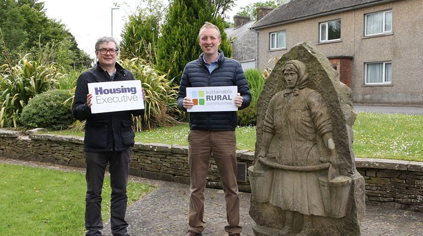 Housing needs in the Rock: Pictured beside an historic monument in The Rock in Co. Tyrone is left to right Eoin McKinney, Housing Executive Rural Unit and Tim Gilpin, Housing Executive Rural and Regeneration Manager. The organisation is conducting research into local demand for social and affordable homes in the surrounding area of The Rock. 