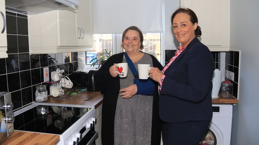 Delighted tenant Patricia McDonnell welcomes patch manager Gillian Fitzpatrick into her new kitchen for a cup of tea.