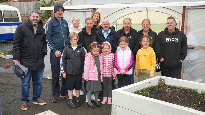 Children and staff from Funky Kids with (left to right), Stephen Gamble and Jonathan Strain, Housing Executive, Lynn Nicholson, Chairperson of Funky Kids and Lesley Cuthbert, Housing Executive.