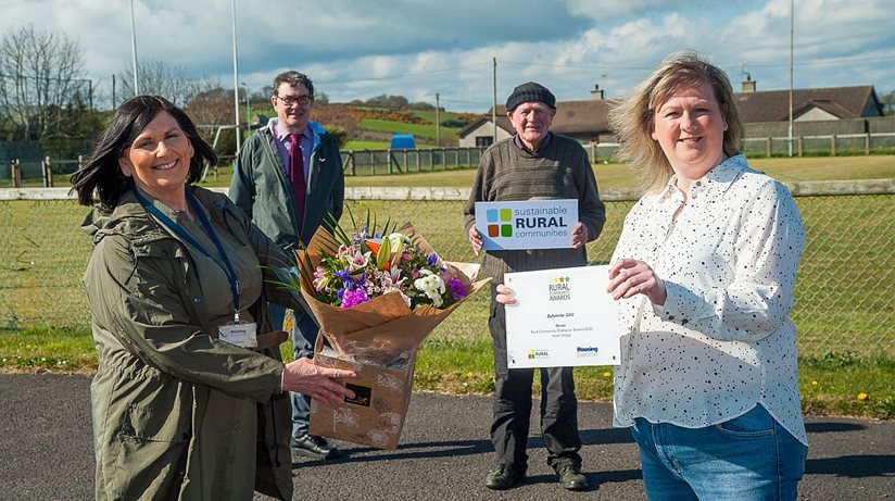 Pictured from left are Anne McCavera and Eoin McKinney from the Housing Executive, Harry Doherty from Ballykinlar GAC and Maria McKeating from Ballykinlar GAC who won the Rural Community Champion Award 2020 for Small Village in South Region.