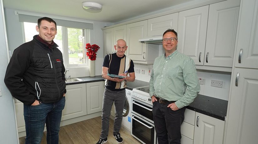 Housing Executive patch manager Freddy Reilly (centre) checks out a new kitchen at Finnis close with David Moore, Moore Macdonald consultants, and Donal O’Hara, from PCD Contracts.