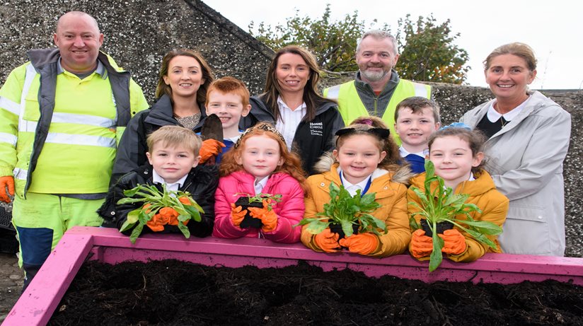 Staff organising the bulbs for planting with the children.