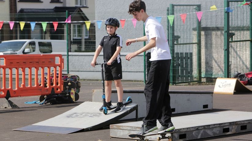 Young people enjoying the skate-park, one of the activities on offer during a fun-day partnership project funded by The Housing Executive and facilitated by Fountain Street Community Association, Strabane Urban Sports and Strabane Ethnic Community Association.