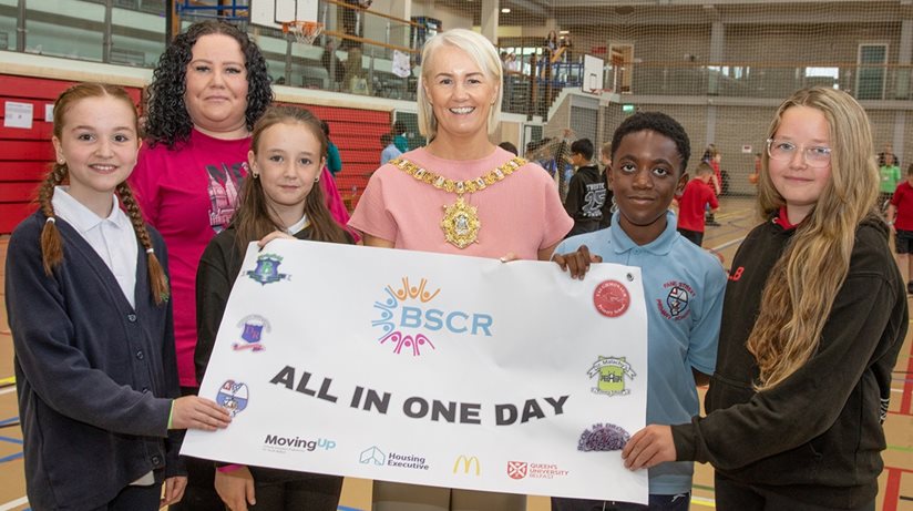 Housing Executive Good Relations Officer Lisa Hull with Belfast Mayor Tracy Kelly and (from left) Kristen McCartney (Blythefield PS), Zara Gourley (St. Malachy's PS), Kederick Odure (Fane Street PS), and Lacey Bather (Taughmonagh PS)