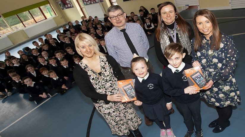 Housing Executive ‘Design Your Dream Home’ Art design competition winners at St. Canice’s PS, Feeney, Amelia (P3) and Dylan (P5) receive their Kindle Fire prizes from Ruth Montgomery, Rural Housing Association and Martina Forrest, Housing Executive (Limavady) at the school on Friday morning. Back centre are Mr. Eoin McKinney, Housing Executive and Mrs. Fiona McCann, Principal. (Photos: Jim McCafferty Photography)