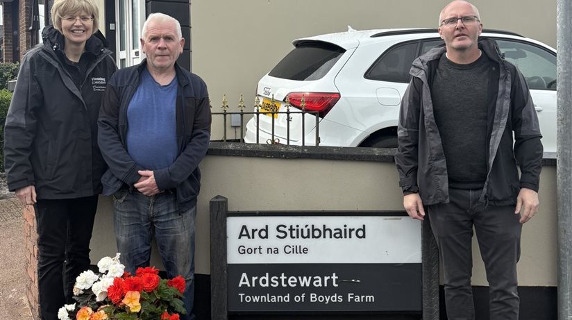 Housing Executive Good Relations Officer Anne Marie Convery and Patch Manager Keith McKinless with Johnny Rush from Stewartstown Community Group.