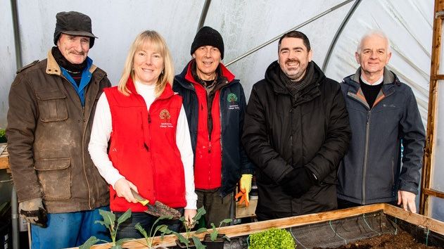 Volunteer Hugh Ross, Monkstown Community Forum community garden manager Margaret Connolly, Monkstown Community Forum development manager Alan Johnston, Housing Executive Good Relations Officer Stephen Gamble, and volunteer George Kirk.