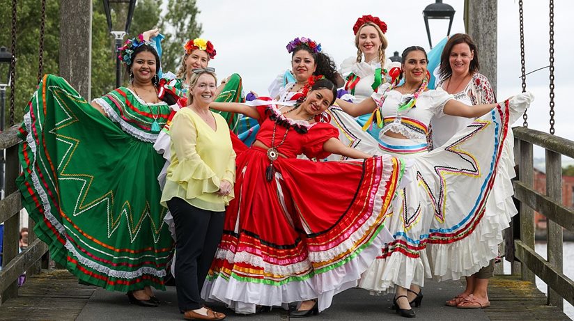 Housing Executive’s Good Relations Officer Amanda Ashe (front left) with a group of performers, Mexican Dance Belfast Group at the Festival of the River.