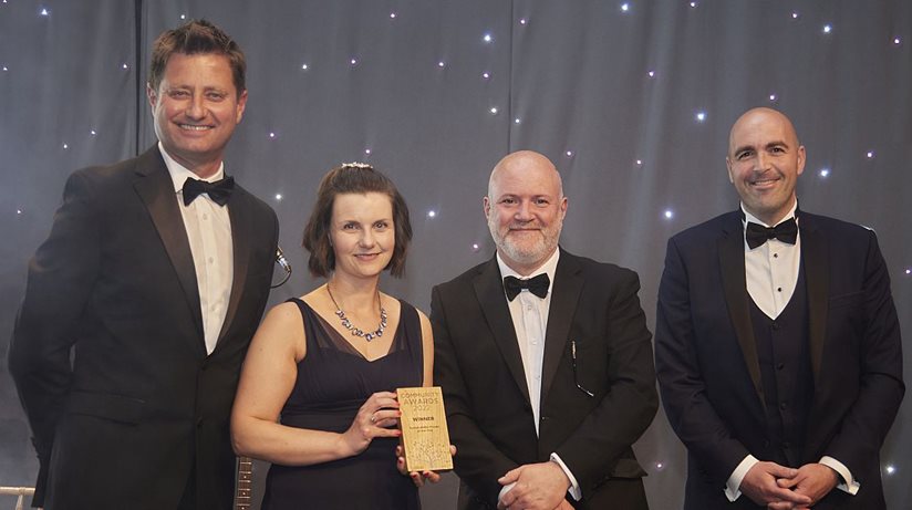 TV presenter and Architect George Clarke presents the Sustainability Project of the Year award to Caroline Best, Architect, Colin Laverty, Energy Officer, and Johnny Despard, Project Manager, for the Housing Executive’s innovative retrofit project.