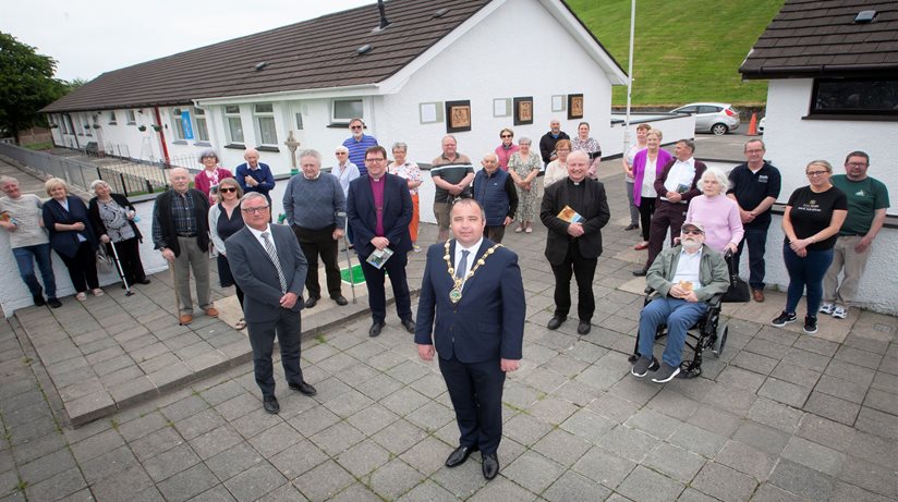 The outgoing Mayor of Derry City and Strabane District Council, Brian Tierney, pictured at the launch of the ‘Reimaging The Wells’ artwork in the Bogside. Included is Eddie Doherty, Area Manager, Housing Executive, church representatives, organisers, artists and local residents.