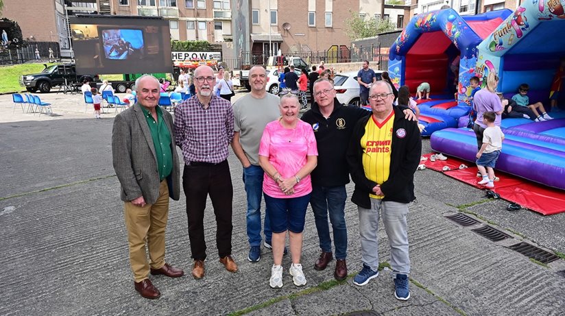 (Left) The Housing Executive’s Dr Seán Brennan with Kate Clarke and members of New Lodge Housing Forum