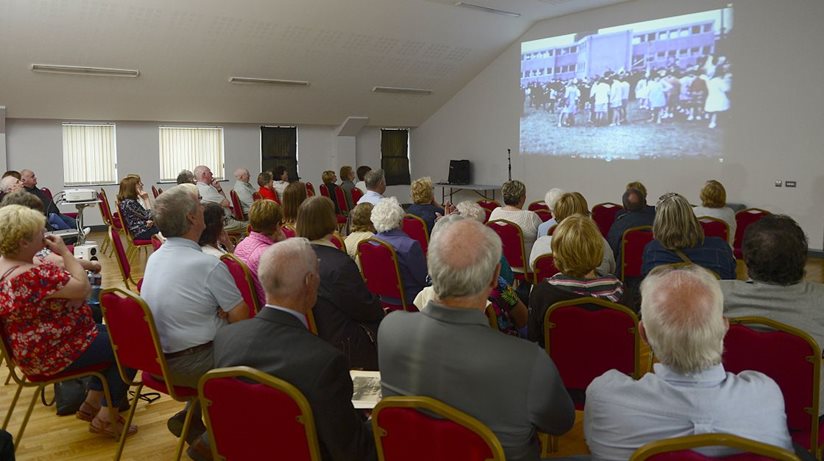 Residents from Stream Street, and Downpatrick, view old footage of the Canon’s Excursion, in Ballymote Centre, Downpatrick.