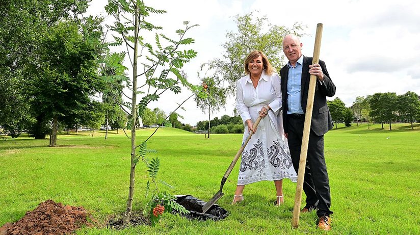 Digging in - Jennifer Hawthorne, the Housing Executive’s Director of Landlord Services, and Malachy Brennan, Belfast grounds manager, plant a new ash tree at Gasvey Park in Dunmurry to mark one million trees having been planted by the housing authority. 