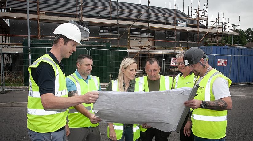 Plans revealed…Members of Lisnafin Ardnalee Trust community group join Housing Executive staff to observe extensive works being carried out at flats in Lisnafin Park, Strabane. From left, Jonathan Kyle, Housing Executive Project Manager, Michael Cunningham, Lisnafin Ardanlee Trust, Sharon Poots, Housing Executive Architect and Works Manager, Camillus Quinn, Lisnafin Ardnalee Trust, Gary Hagan, Housing Executive Site Manager, and Michael Curran, Housing Executive Direct Specialist Works Manager.