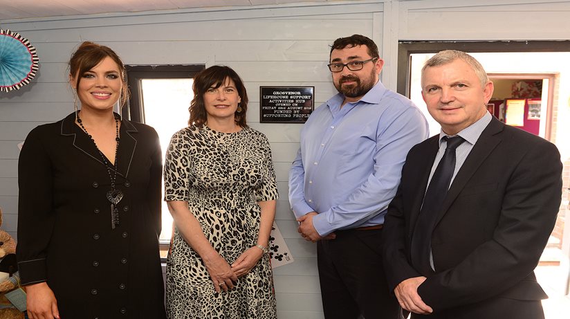 (L-r) Rioghnach Murphy, Shared Services Manager at Glen Alva & Grosvenor Centres poses with Supporting People’s Bernie Crossan, The Salvation Army’s Assistant Regional Manager, Steven Potter and the Housing Executive’s Des Marley, beside a plaque marking the opening of the Support Activities Hub.