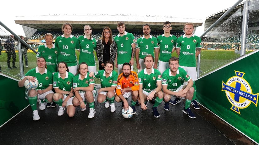 Our Caroline Connor poses with the Street Soccer NI squad.