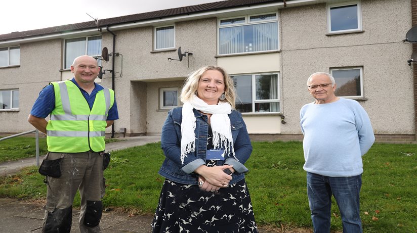 (Right to Left) Pictured celebrating his newly refurbished kitchen is West Winds resident Jimmy Menagh with the Housing Executive’s Newtownards team Leader Jill Gallagher and Terence Lennon from contractor Peter O’Hare’s.