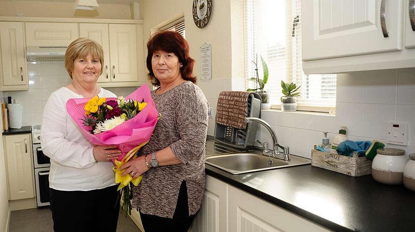 Kim Hepburn (right) from Richhill, shows Patch Manager Caroline Smyth round her brand new kitchen.