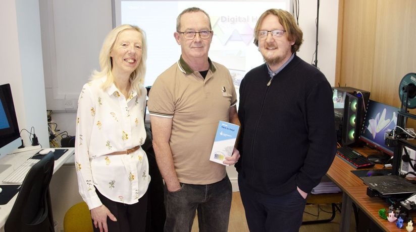 Strabane Community Unemployed Group (SCUG) co-ordinator Perpetula Foley, Housing Executive Good Relations Officer Eddie Breslin, and SCUG Digital Hub co-ordinator Tim Jenkins at the digital hub in Upper Main Street, Strabane. 