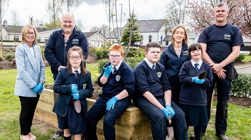 Pictured after planting flowers at the new community garden in Greystone Park, Limavady are pupils from Rossmar School along with Housing Executive staff L-R: Hilary Canning Local Office Manager, Chris Hogg Grounds Supervisor, Alana Donnelly Patch Manager and Mark Hunter Grounds Supervisor.