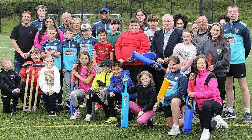 Cricket connects community… The adults joining the children at Strabane Ethnic Community Association’s summer project are (from left) Andrew Mullan, Housing Executive Good Relations Officer, West area, Jamie Dalzell, Kamini Rao, Richard Dalzell, Bobby Rao, Katie Guy, Darren Guy, Deputy Mayor of Derry Strabane District Council and David Guy. 