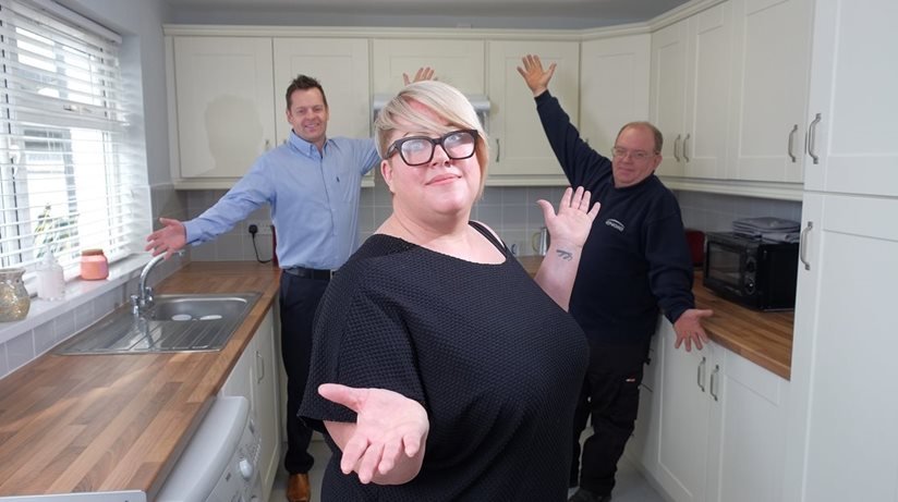 Grainne Byers shows off her new kitchen to Housing Executive patch manager Steven Munn and Adrian McToal, from Engie. Fifty-seven homes benefited from a major upgrade, which included replacement bathrooms, in the Ards Peninsula scheme costing £500,000. 