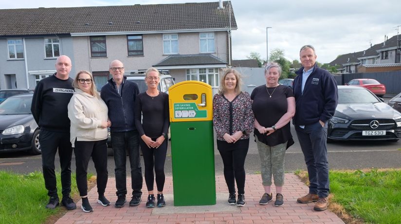 Coolnafranky Park Residents’ Group at the site of the new defibrillator with the Housing Executive’s Shane Conlon