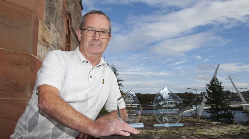 Housing Executive Good Relations Officer Eddie Breslin displays his well-deserved awards.