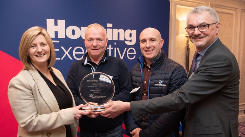 Pictured L-R: Grainia Long, Chief Executive presents winners Adrian Hetherington and Nicky Park, Hetherington Painting and Building Contracts, with their Health & Safety Contractor of the Year Award 2023 for Planned Maintenance along with Chris Welch, Chair of Asset Management Maintenance Committee. 