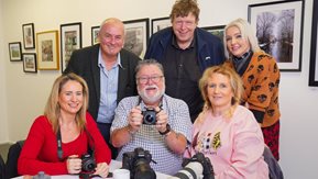 Housing Executive good relations officer Dr Sean Brennan (back left) with by some of the participants.