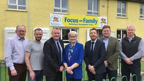 A group of people stand in front of the Focus on Family Centre in Coleraine.