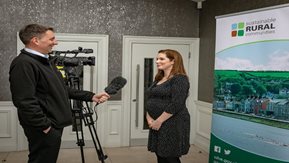 BBC interviewer with the Housing Executive's Sinead Collins