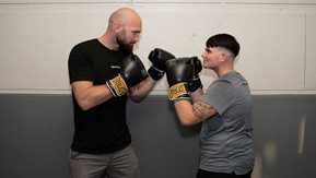 Stephen squares up to Terry in a mock boxing pose.