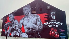 A large mural that features Carl Frampton and Katie Taylor.