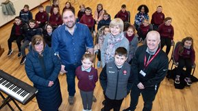 St Malachy’s Primary school children, Edward Gribben, Jacqueline Devlin, Niall McGurgan and Anne Marie Convery in a school assembly hall.