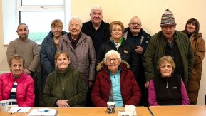 A group of 12 men and women.