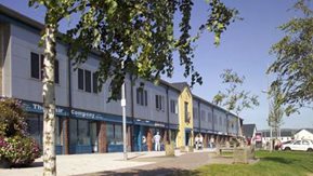 A row of Housing Executive shops with accommodation above.