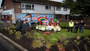 Enagh Youth Forum members and Housing Executive staff after planting.