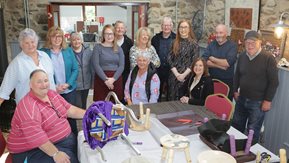 At The Mill at Cloughmills are members of Cloughmills Community Action Team, Eilish McGarry, Freda McKnight, Wilbert Smyth, Harry Devlin, Eamon O’Toole, Margaret Anne Reid, Gerald Connelly and Muriel Whitten. They are joined by Deirdre Casey, Ballymoney Housing Team, Anna Margaret Jamieson, Workshop Tutor and Jim Whitten, Secretary of Cloughmills Community Action team, Lynsey Quinn, Housing Executive Patch Manager, and Joanne White, Housing Executive Team Leader.