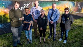 At the launch of the Doury Road mural in Ballymena are (left to right) John Read, Housing Executive Good Relations Officer, Roy McClean, Housing Executive Mid and East Antrim Area Manager, mural artists Carly Wright and Sam McAleese and Jan Roscoe, Community Coordinator, Doury Road Development Group, and Roni Browne, Finance and Admin officer Doury Road Development Group.