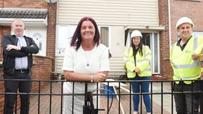 Several men and women are pictured, some with hard hats and high visibility clothing.