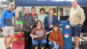 At the Millburn Smile Project’s fun day are (back row from left) Joel Cromie, Housing Executive Patch Manager, Gareth Doran, Housing Executive Good Relations Officer, Jenny Millar, Margaret Glendinning, Stella Boyd, Millburn Community Association, Billy Ellis, Millburn Community Outreach worker. Front row from left, Karen Douglas and Marilyn Donaghy, Millburn Community Association. 