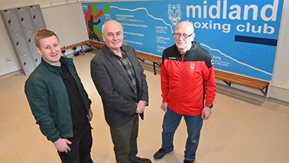 David McErlean, Dr Sean Brennan and Sam Cochrane are shown stand in front of the new mural in the Midland Boxing Club.