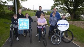 Young people from Enagh Youth Forum are joined by Eamonn O’Donnell, Enagh Youth Forum, Michael Cooke, Patch Manager, Housing Executive and Paul Hughes, Youth and Community Worker, Enagh Youth Forum.