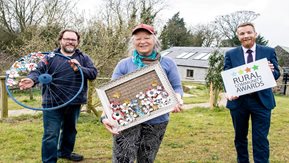 Mandy, Mark and Patrick pose with artwork and reward.