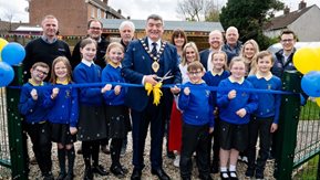 Mayor Noel Williams opens Sunnylands Primary School allotments with Sunnylands Primary School pupils, Housing Executive staff and local elected representatives. 