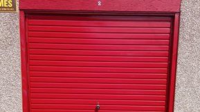 A garage with a red door in Ballykeel 1, Ballymena. Garages are available to r