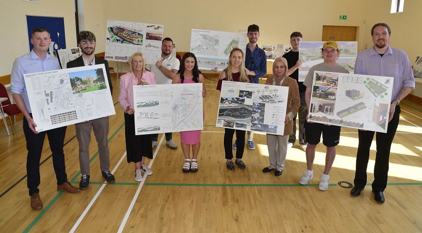 Staff and students hold some of the designs