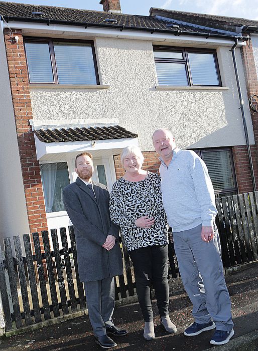 Tenants outside their home.